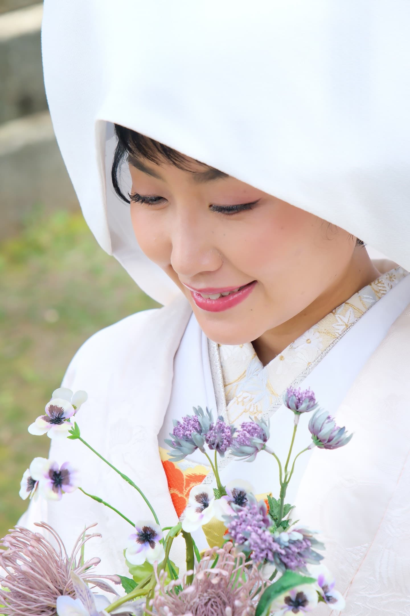 洋髪で綿帽子をした白無垢の花嫁様